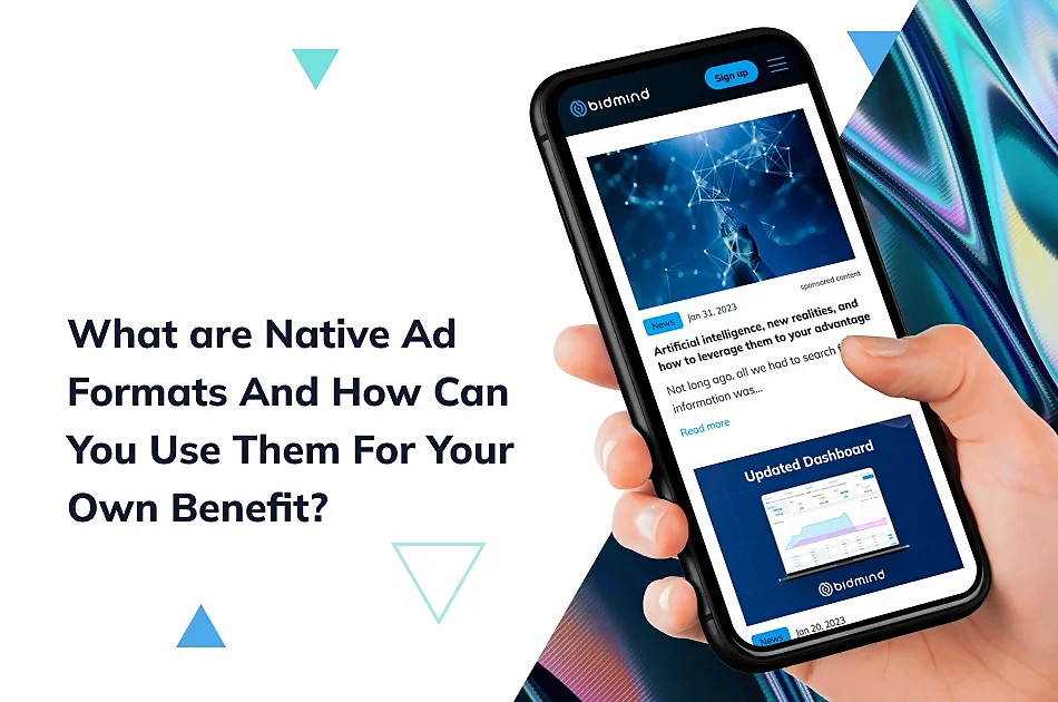 The image is a graphical representation with a focus on the concept of Native Advertising. It features a person's hand holding a smartphone, which displays an example of a native ad within a social media interface. The ad includes an article titled "Artificial intelligence: new realities, and how to leverage them to your advantage" dated January 31, 2023, labeled as sponsored content. Below this is a smaller image of an "Updated Dashboard" screen from a news feed dated January 29, 2023. Above and around the smartphone are abstract digital graphics and shapes in blue tones, suggesting a high-tech theme. The bold text above the smartphone reads "What are Native Ad Formats And How Can You Use Them For Your Own Benefit?" It implies an educational context, possibly for marketing professionals or businesses looking to utilize native ads. The overall design is sleek and modern, with a mix of visual elements to draw attention to the importance of native advertising in current digital marketing strategies.