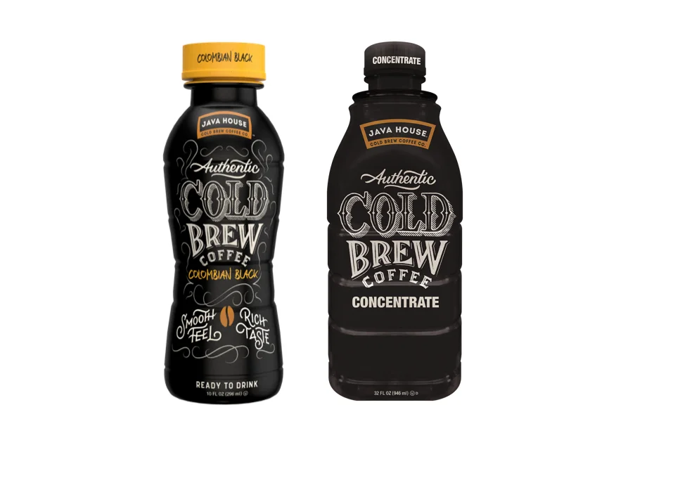 Two bottles of JAVA HOUSE cold brew coffee are displayed side by side. The bottle on the left, labeled “COLOMBIAN BLACK”, has a yellow cap and is ready to drink. The intricate white lettering on its dark body reads “Authentic COLD BREW COFFEE” with the additional text “SMOOTH FEEL RICH TASTE”. The bottle on the right, labeled “CONCENTRATE”, has a black cap and contains concentrated cold brew coffee. Both bottles are against a white background