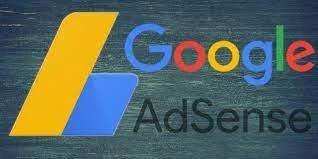 The image displays a textured dark background with the Google AdSense logo superimposed on it. The logo starts with a stylized, colorful capital 'G' followed by the rest of the Google name in lowercase, multicolored letters. Next to it, the word 'AdSense' is spelled out in a plain white font. On the left side of the Google name, a large blue tag or folder icon represents the AdSense service. The logo elements are designed with a slight shadow, giving them a raised, three-dimensional appearance against the rustic backdrop.