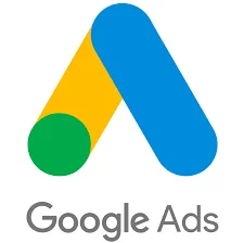 The image features the Google Ads logo which consists of two overlapping geometric shapes, resembling a capital letter 'A'. The bottom shape is yellow with a green semicircle on one end, and the top shape is blue. Below the logo, "Google Ads" is written in a simple, grey sans-serif font. The logo is centered on a plain white background, emphasizing the clean and minimalist design associated with Google's branding. The image likely serves as an emblem for Google's advertising services, focusing on the effective sizes of advertisements for website optimization.