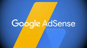 The image displays the Google AdSense logo, which consists of a stylized lowercase 'a' depicted as a folded corner in blue over a larger yellow rectangle, suggesting a page or document. The words "Google AdSense" are written in white against the blue background of the 'a'. The design elements are set against a deeper blue backdrop that creates a sense of depth. This image is likely used as a visual reference for guides or informational content on how to use Google AdSense, specifically in the context of integrating it with a Blogger website.